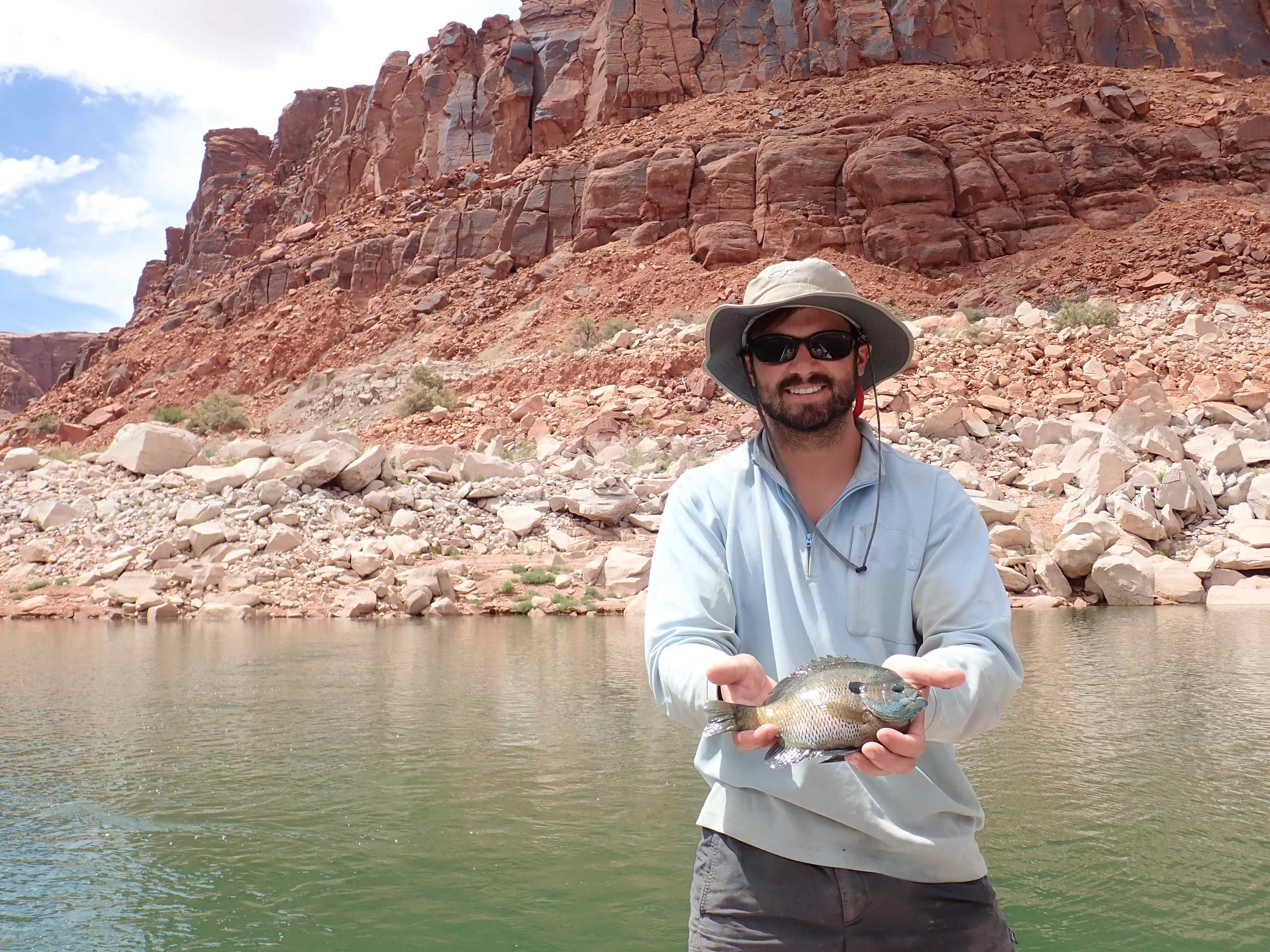 Dr. Garrett Hopper holding a fish