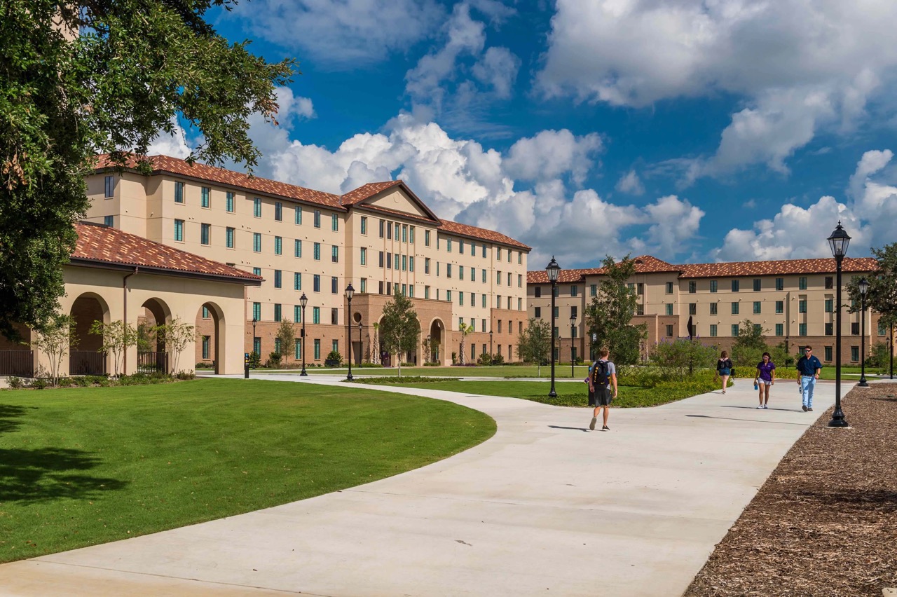 Image of camous dorms and students walking