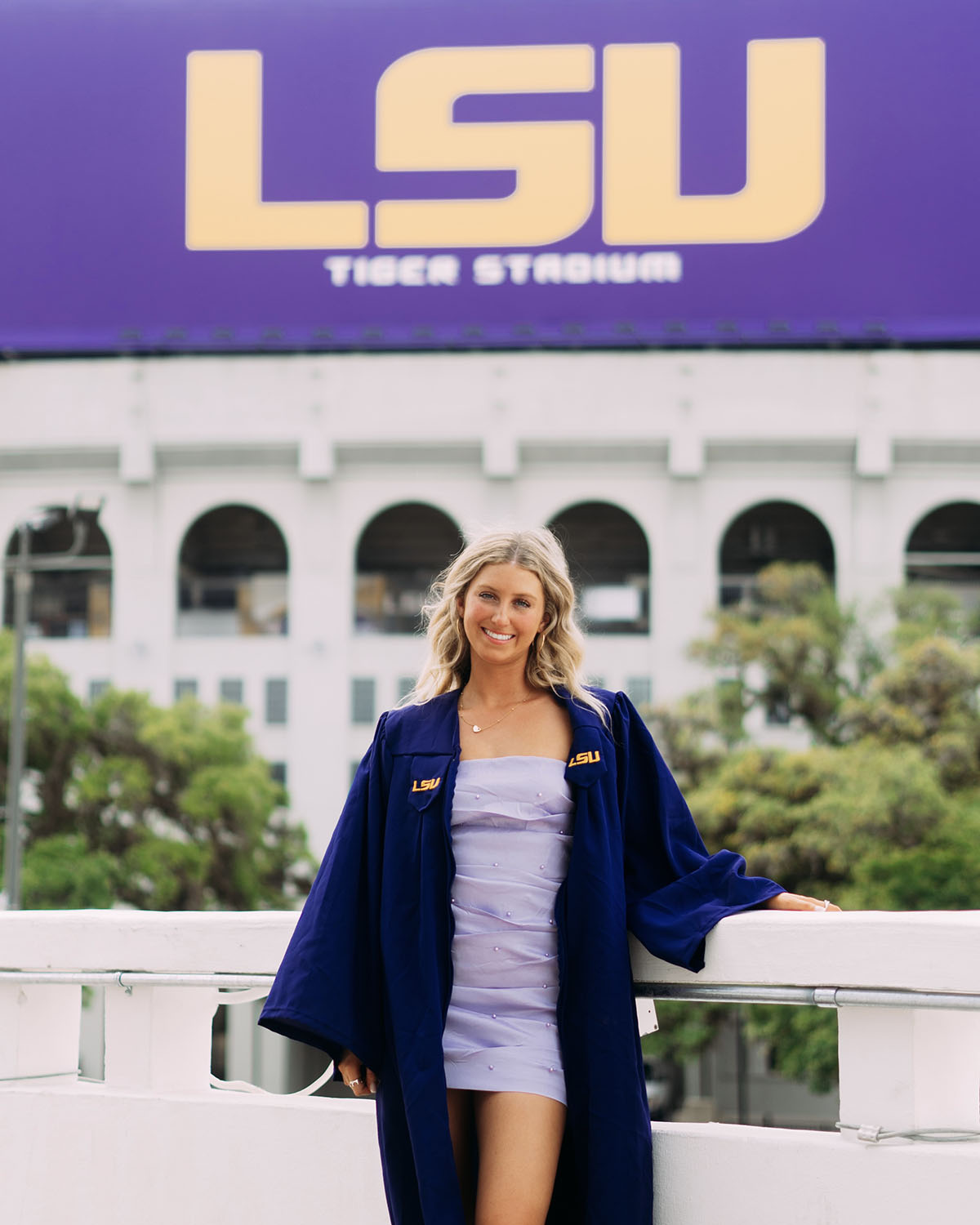 Lillian Beck poses in front of LSU stadium sign