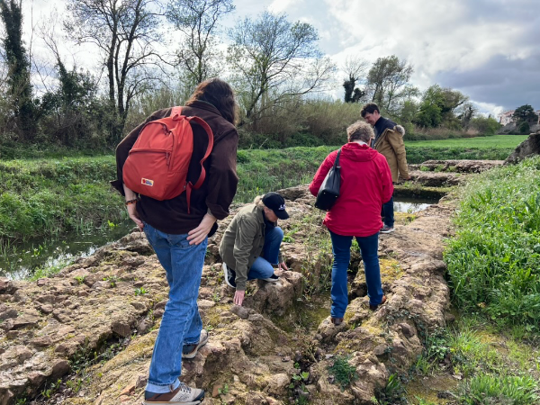 Ilgenfritz studies rock formations in the field.
