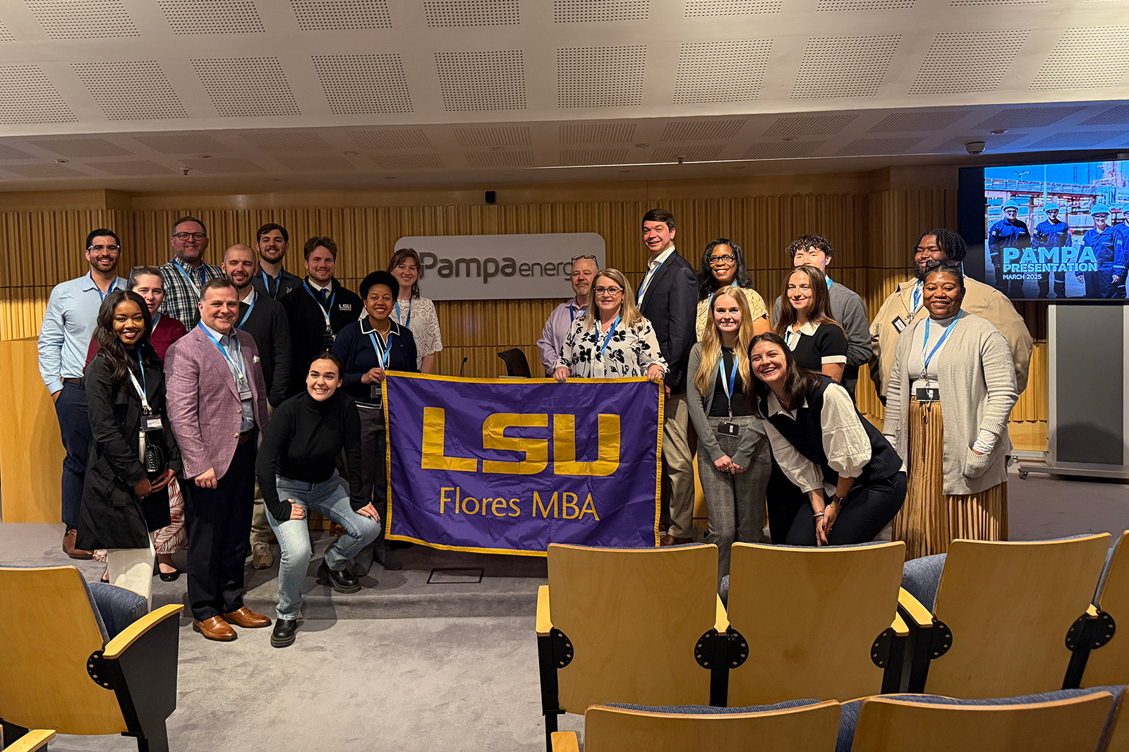 LSU students pose in the presentation auditorium of Argentinian energy firm Pampa Energy.