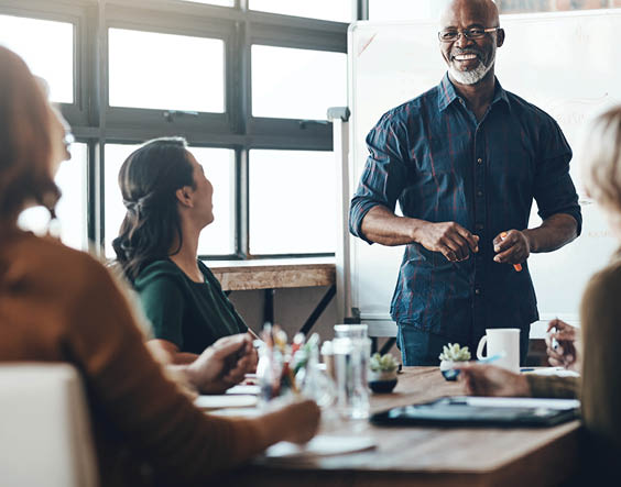Shot of a businessman giving a presentation to his colleagues in a boardroom